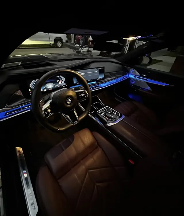 BMW interior with blue ambient lighting after a detail