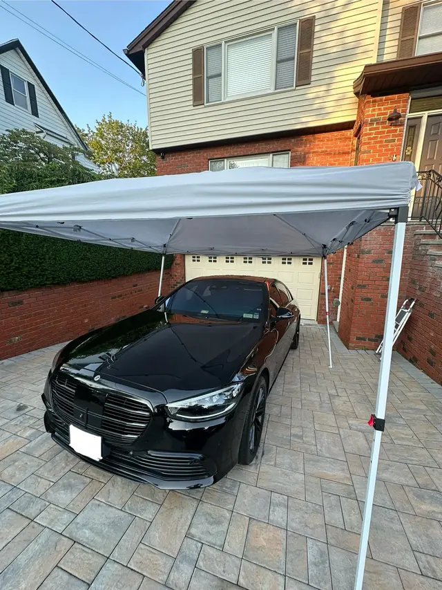 Black Mercedes S-Class set up under our pop-up tent for a hand wash