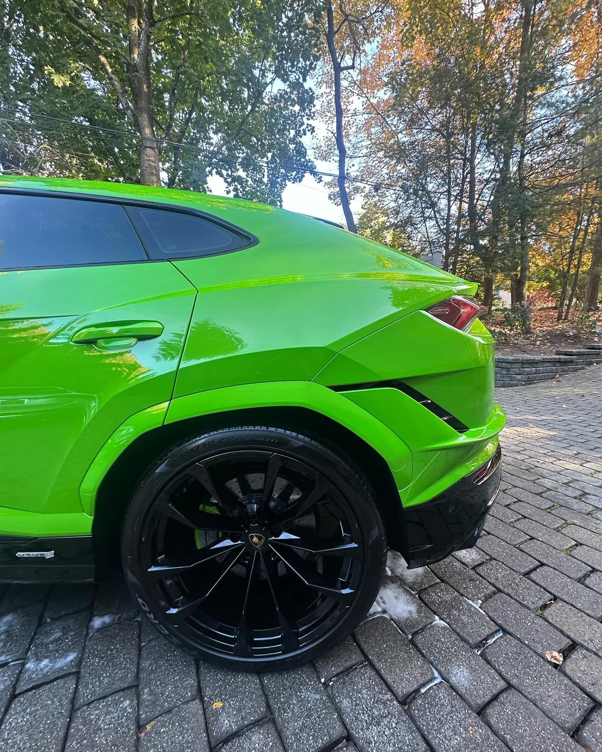 Lime green Lamborghini Urus with a deep, glossy finish
